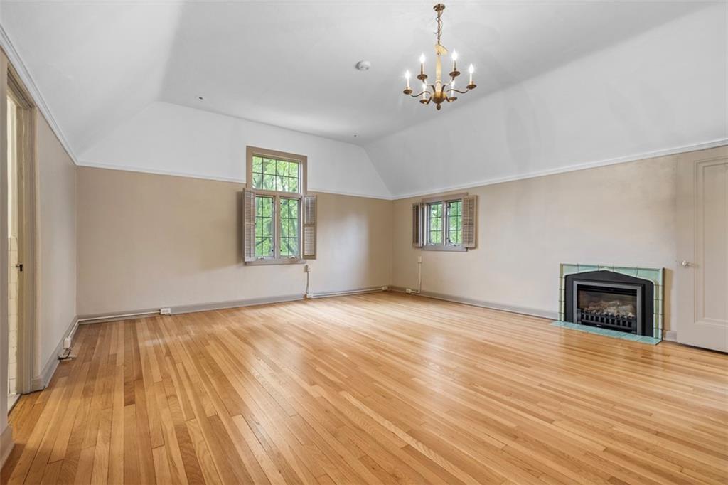 1 Robin Road Pittsburgh, PA 15217 - Photo 35 of 48 an empty room with wooden floor windows and fireplace