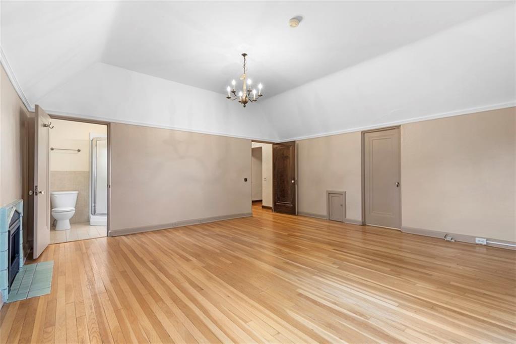 1 Robin Road Pittsburgh, PA 15217 - Photo 36 of 48 a view of an empty room with wooden floor