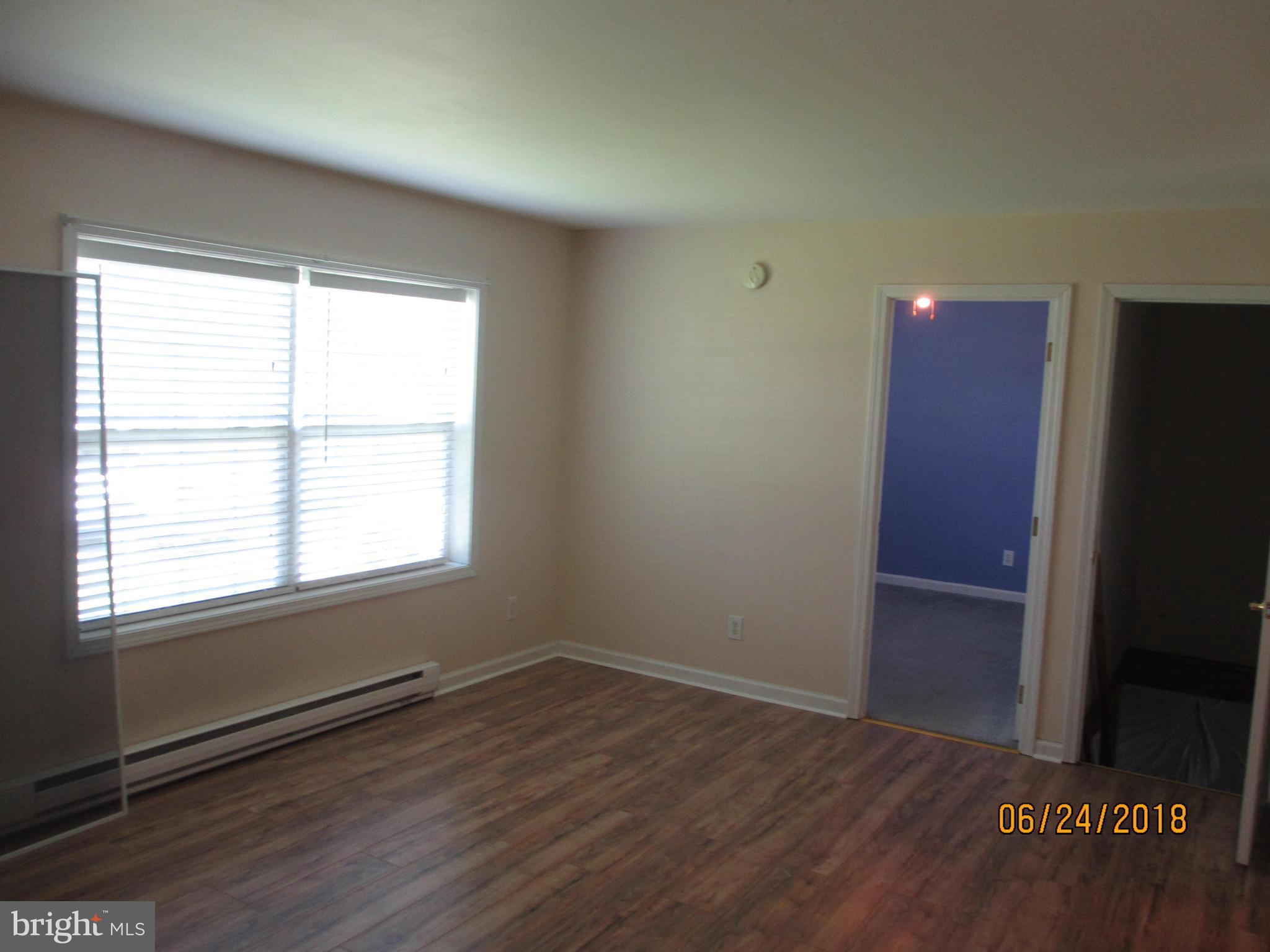 5732 Allender Road White Marsh, MD 21162 - Photo 8 of 15 an empty room with wooden floor and windows