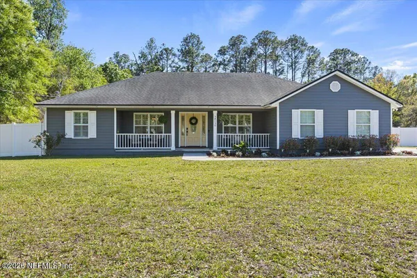 a front view of a house with yard