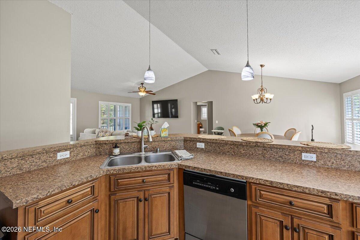54130 Church Road Callahan, FL 32011 - Photo 15 of 42 a kitchen with a sink and a refrigerator