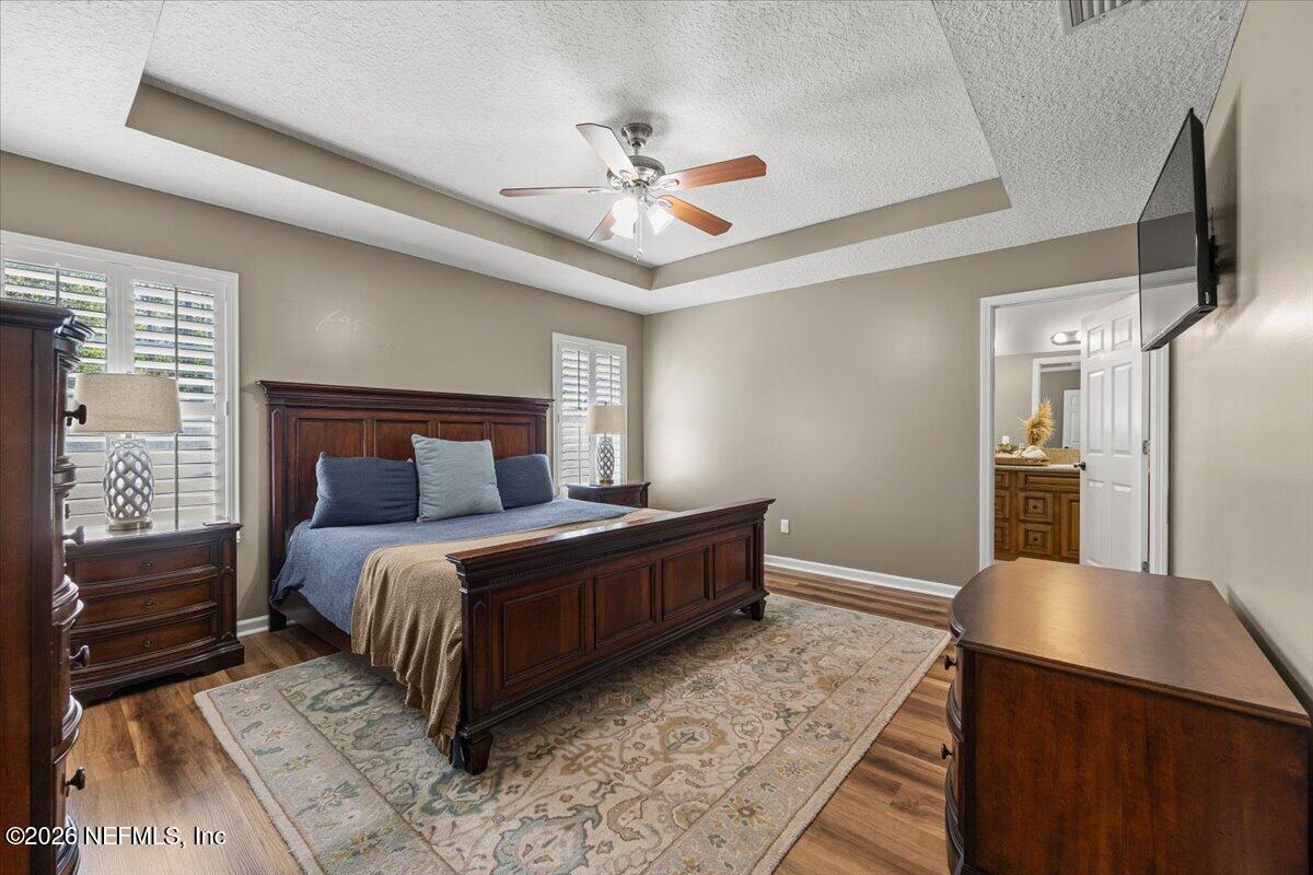 54130 Church Road Callahan, FL 32011 - Photo 22 of 42 a bedroom with a bed and wooden floor