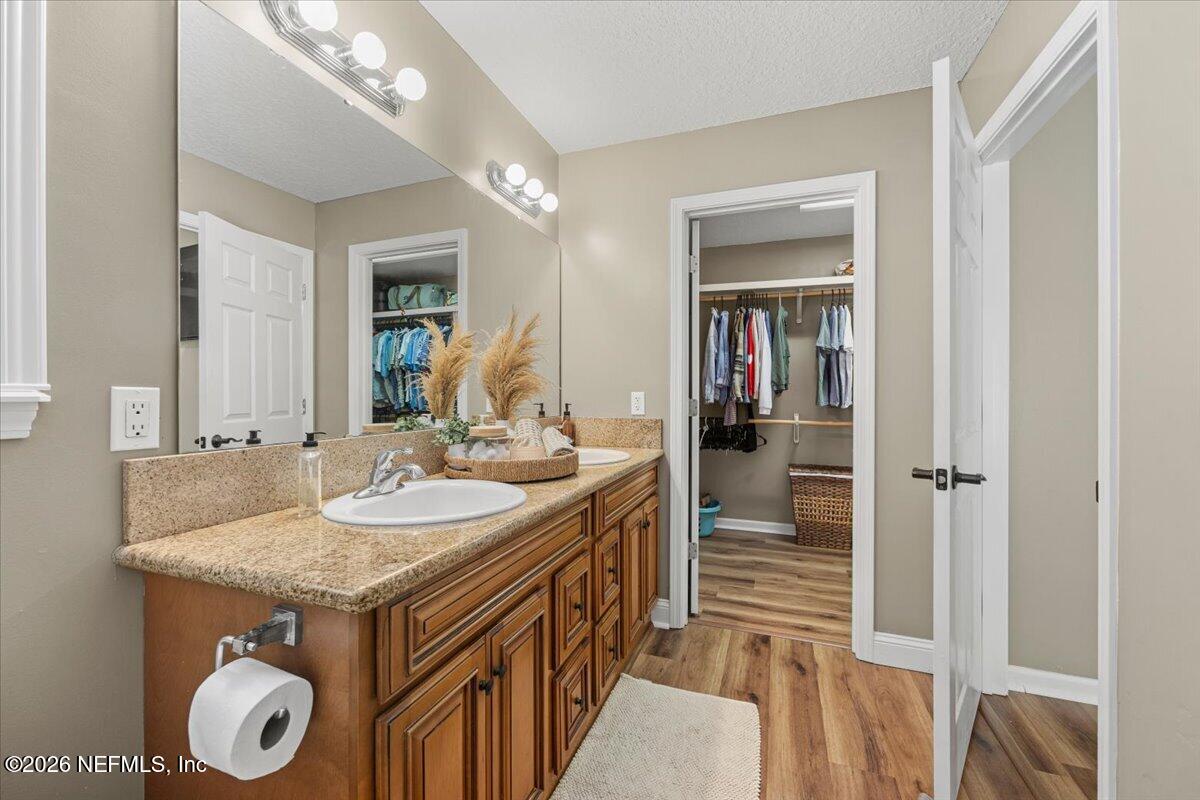 54130 Church Road Callahan, FL 32011 - Photo 27 of 42 a bathroom with a sink a vanity and a mirror