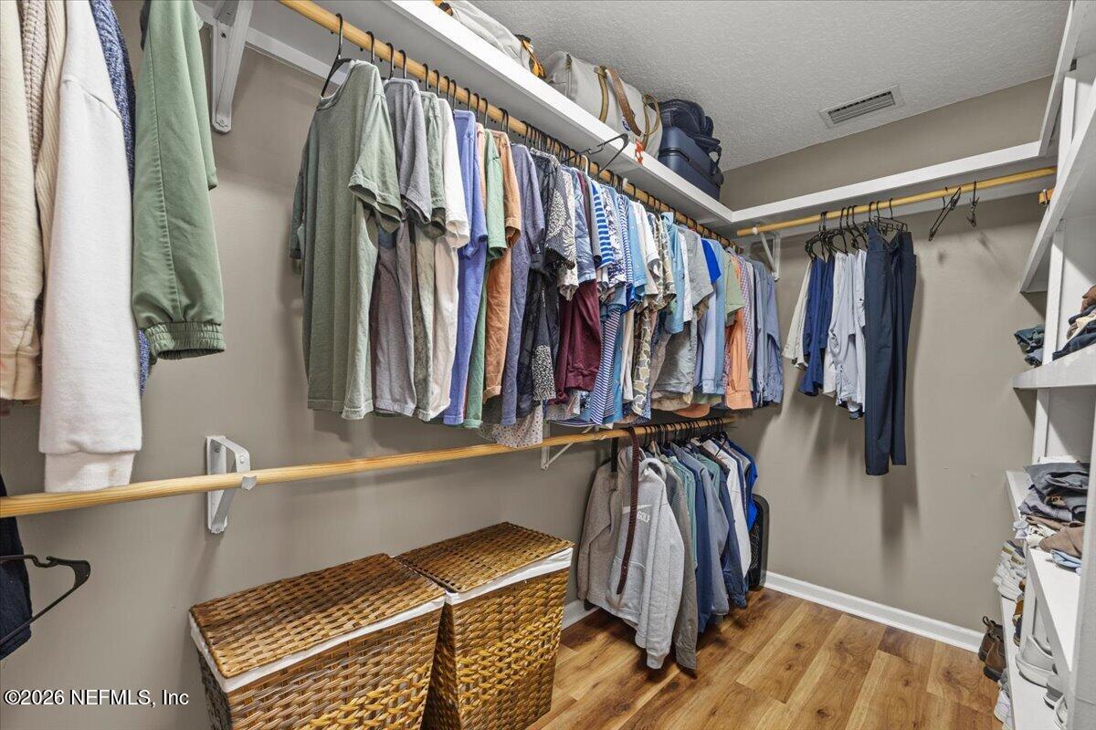 54130 Church Road Callahan, FL 32011 - Photo 28 of 42 a view of walk in closet with clothes and shoes