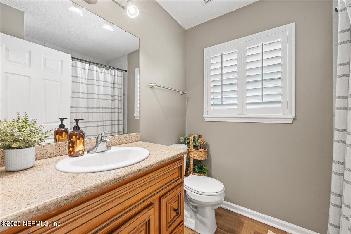 54130 Church Road Callahan, FL 32011 - Photo 31 of 42 a bathroom with a sink a toilet and tub