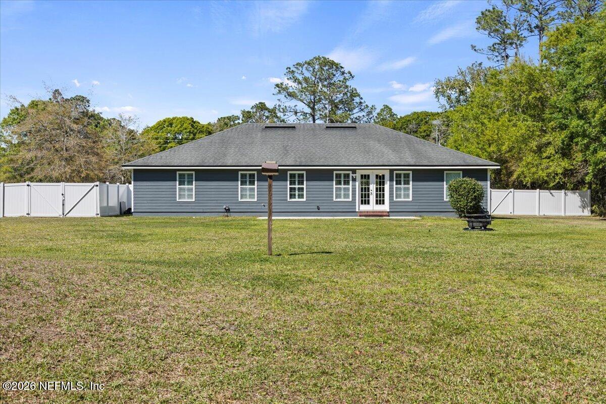 54130 Church Road Callahan, FL 32011 - Photo 39 of 42 a house view with a garden space