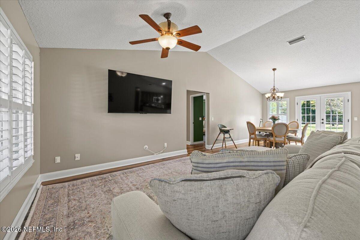 54130 Church Road Callahan, FL 32011 - Photo 7 of 42 a living room with furniture and a flat screen tv