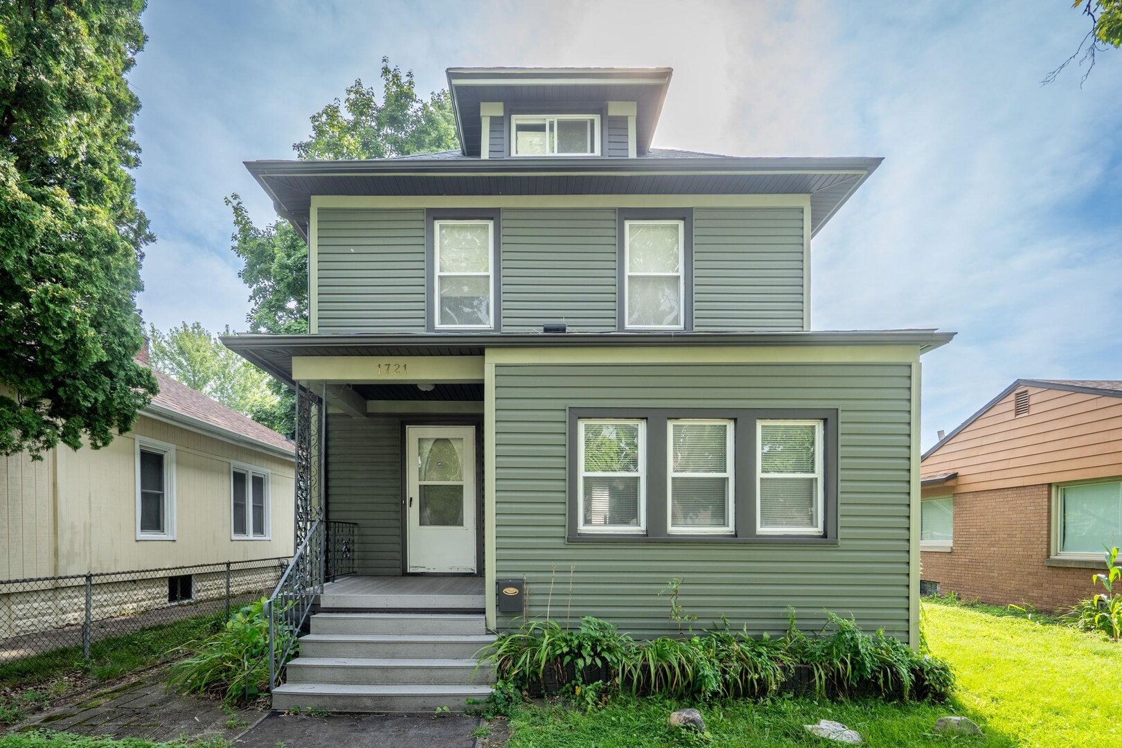 1721 28th Street Rock Island, IL 61201 - Photo 1 of 27 a front view of a house with garden