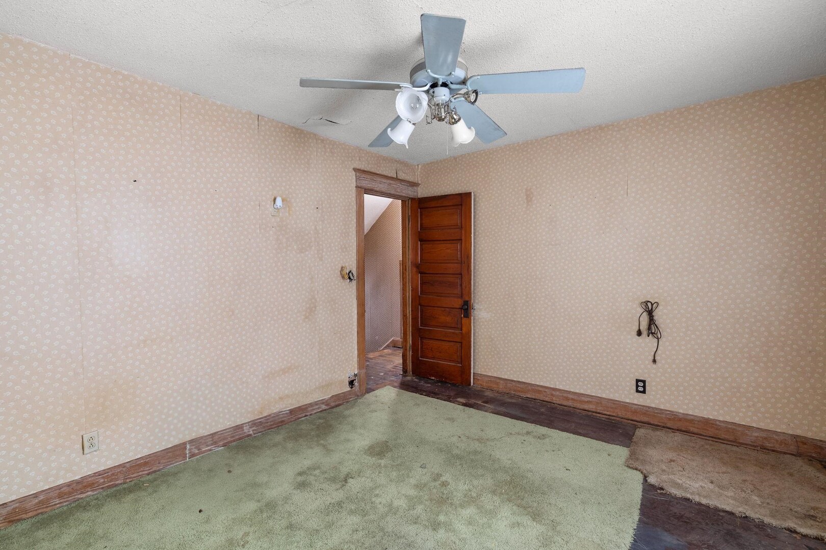 1721 28th Street Rock Island, IL 61201 - Photo 13 of 27 an empty room with closet and chandelier fan