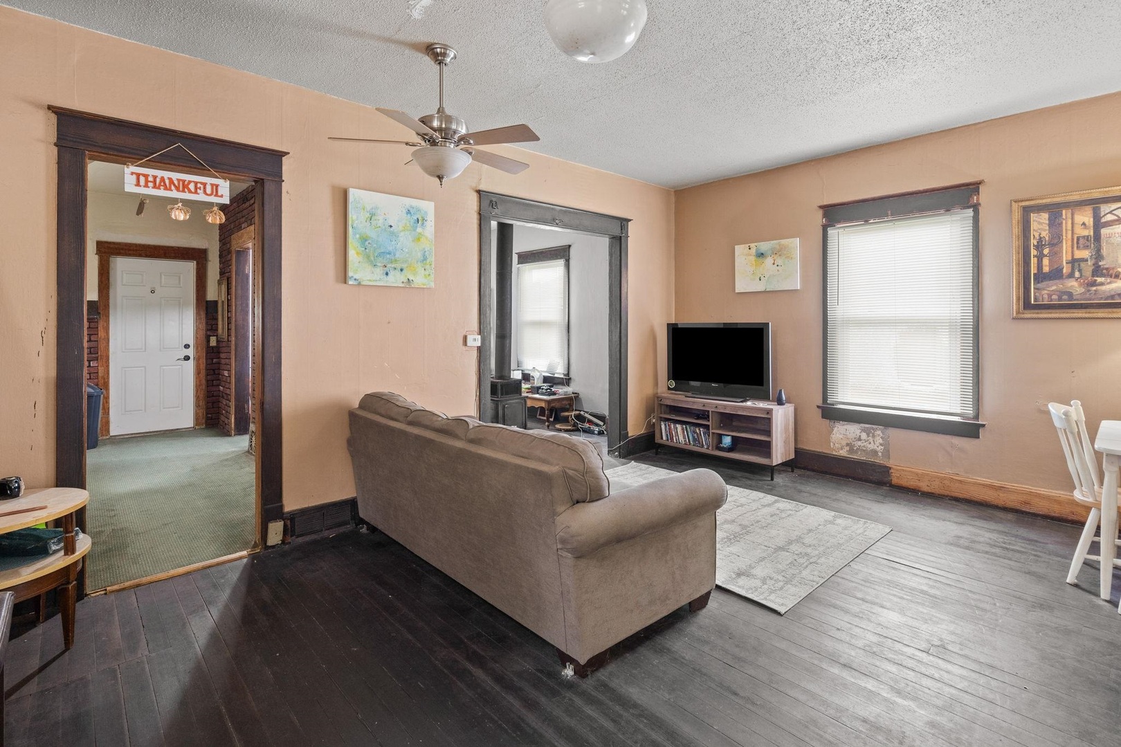 1721 28th Street Rock Island, IL 61201 - Photo 5 of 27 a living room with furniture and a flat screen tv