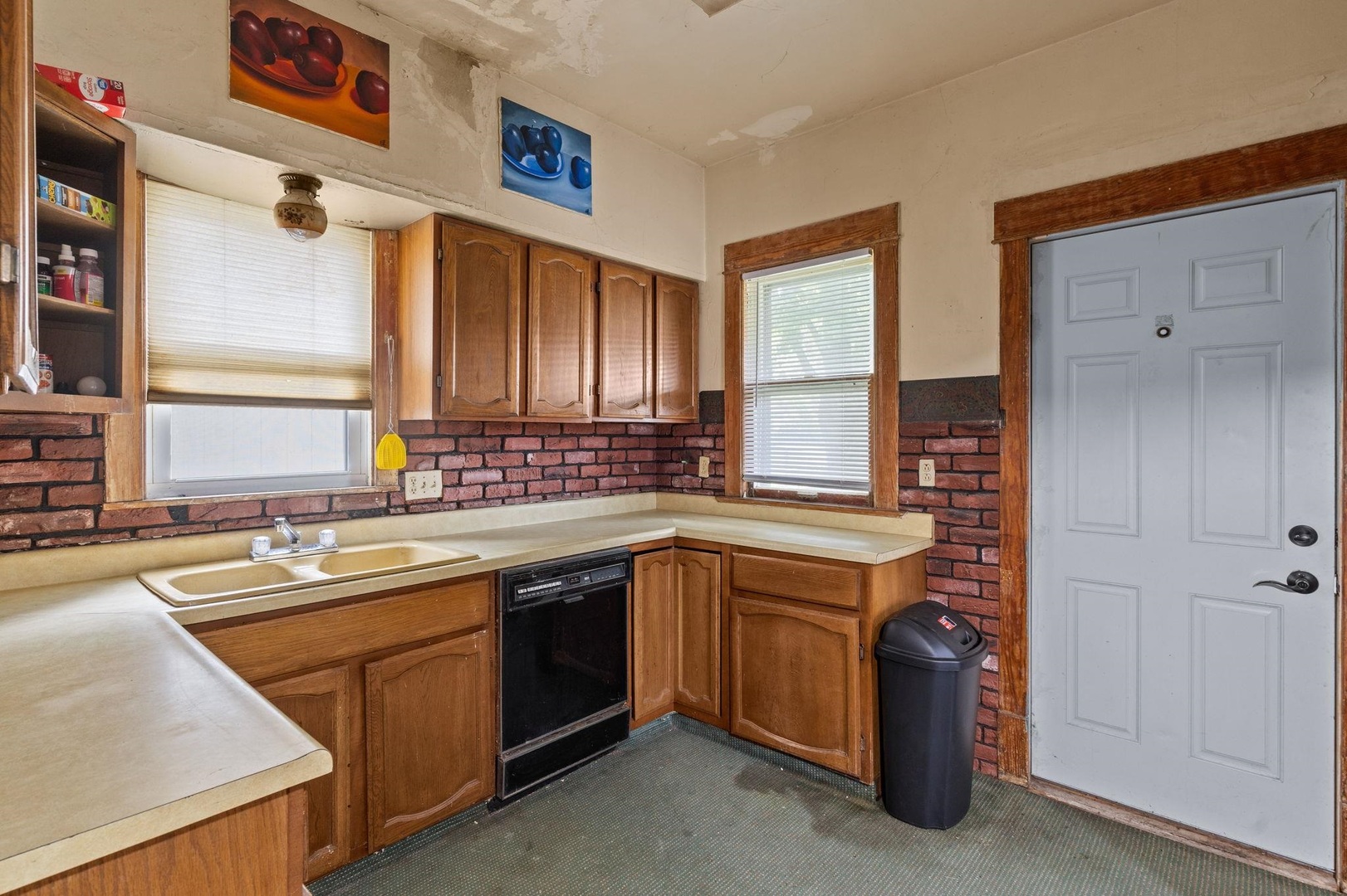 1721 28th Street Rock Island, IL 61201 - Photo 7 of 27 a kitchen with a sink stove and cabinets