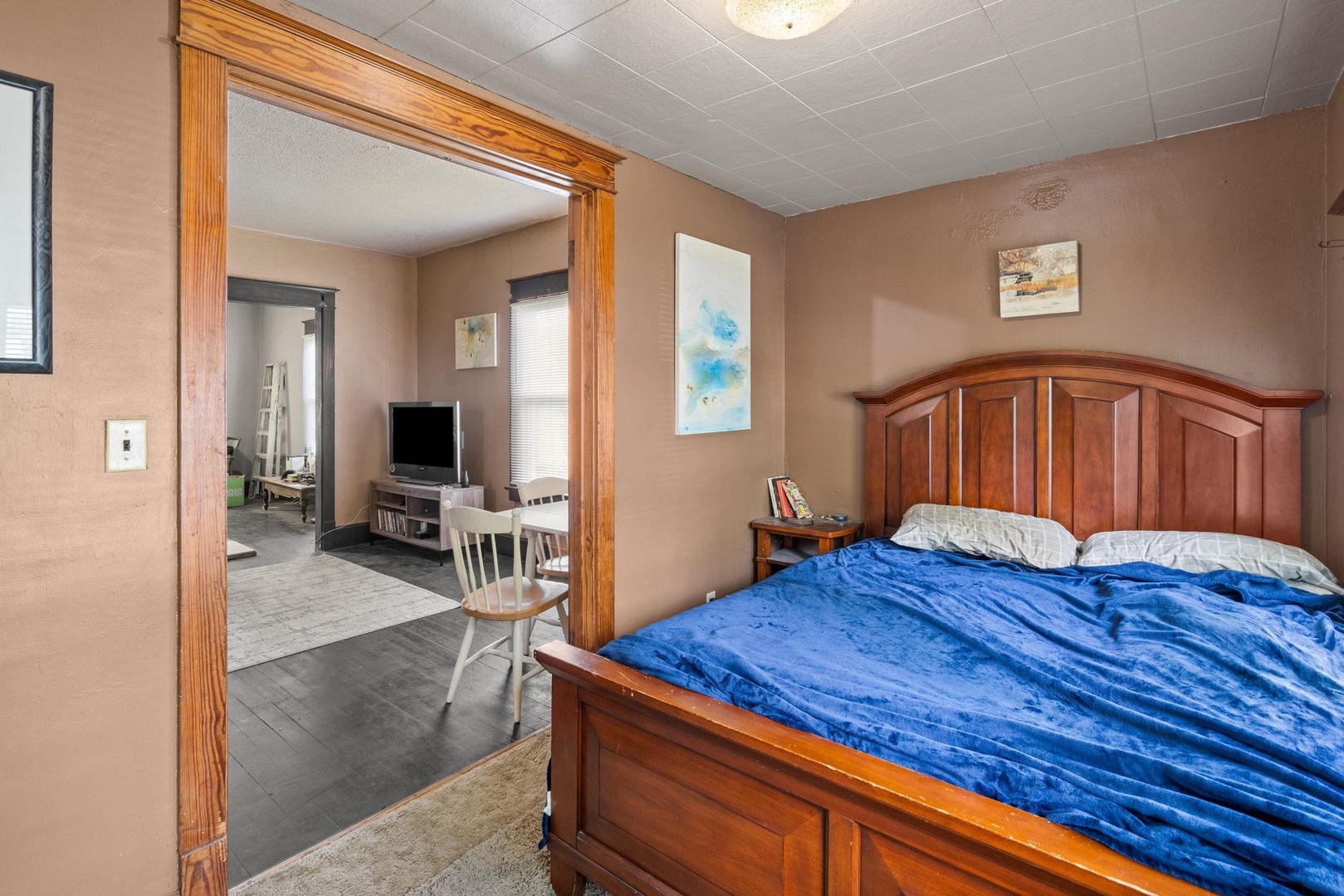 1721 28th Street Rock Island, IL 61201 - Photo 10 of 27 a bedroom with a bed and a flat screen tv