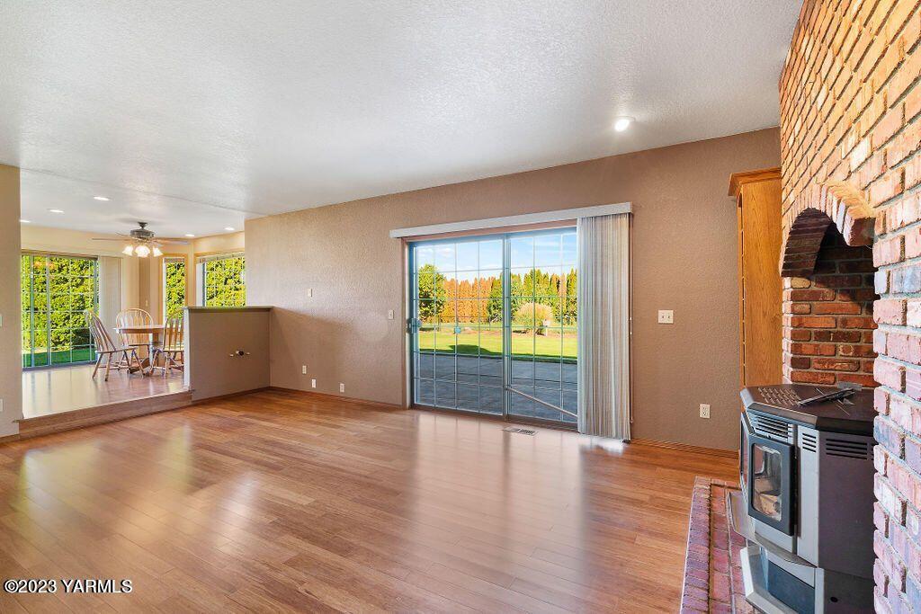1703 Stein Road Yakima, WA 98908 - Photo 15 of 41 a view of an empty room with window and wooden floor