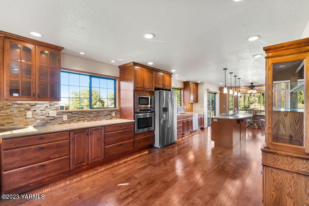 1703 Stein Road Yakima, WA 98908 - Photo 7 of 41 a kitchen with stainless steel appliances granite countertop a refrigerator and stove