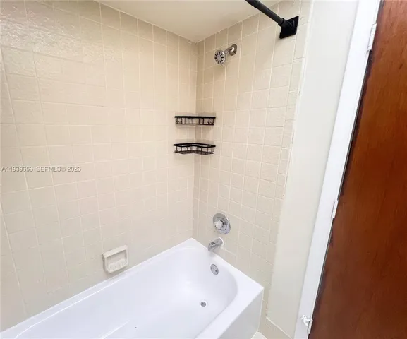 a bathroom with a white bath tub