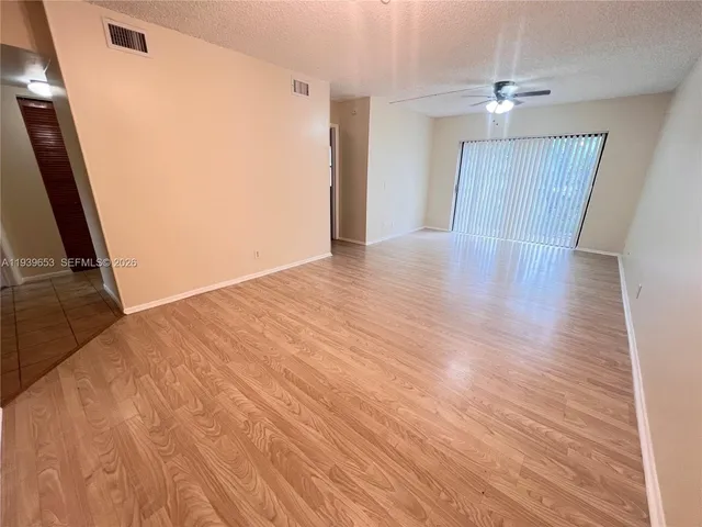 a view of a livingroom with wooden floor