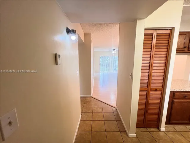 a view of a bathroom from a corridor