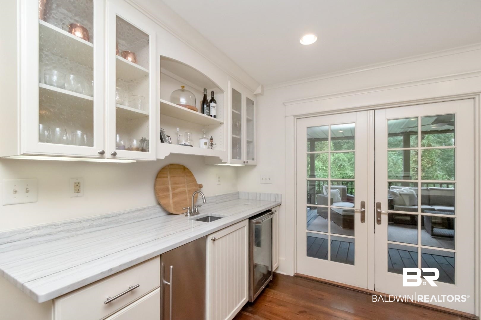 4810 Mums Court Mobile, AL 36608 - Photo 12 of 50 Indoor wet bar with open shelves, glass insert cabinets, dark wood-style flooring, white cabinetry, and recessed lighting
