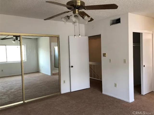 a view of wooden floor and a window in a room