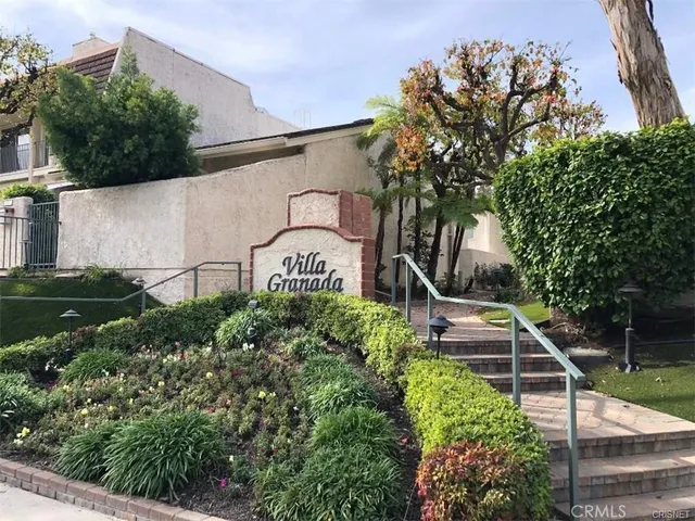 a sign that is on the side of the house