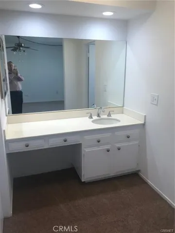 a kitchen with a sink a microwave a stove and refrigerator