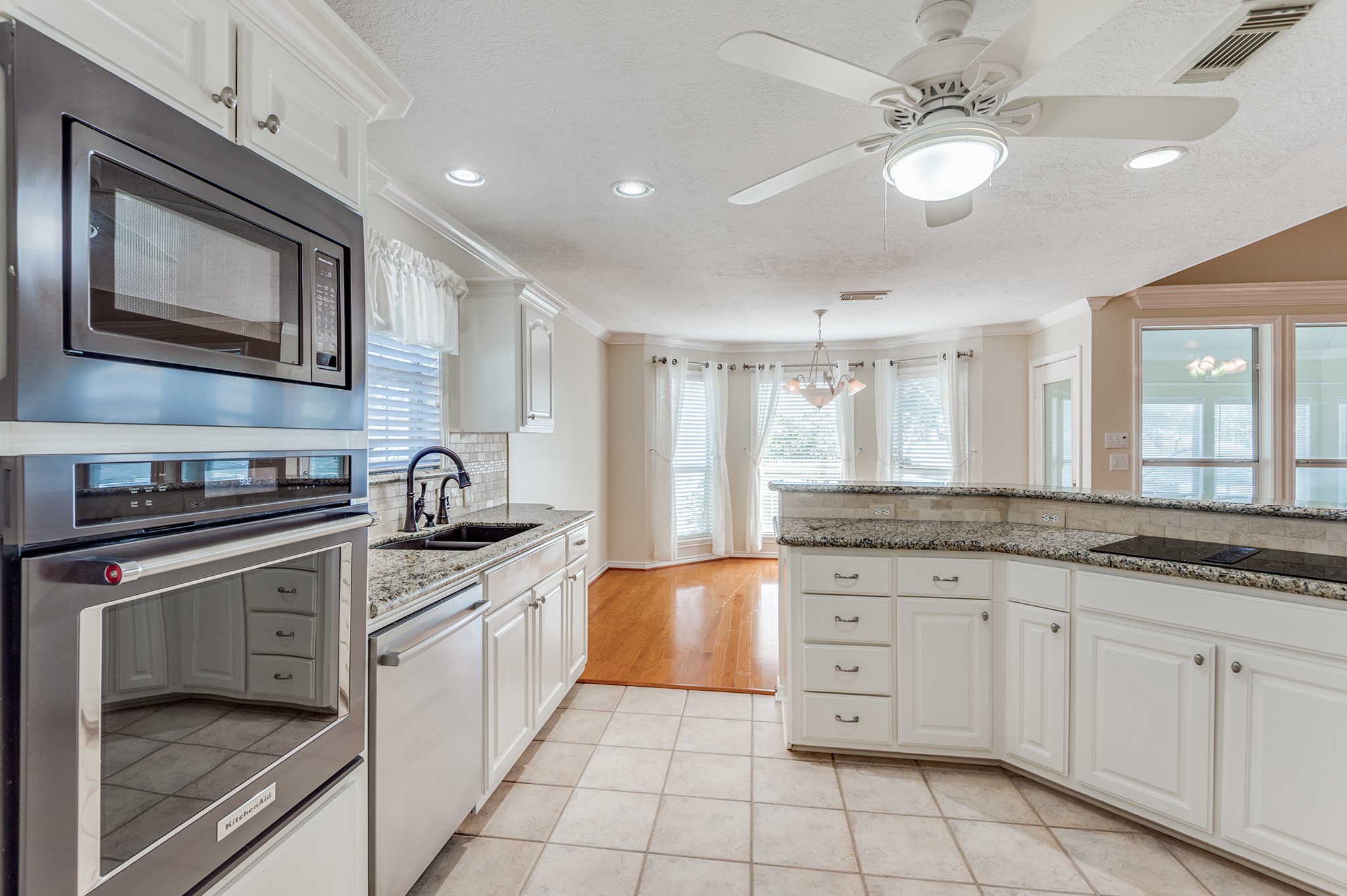 341 Sam Houston Loop Point Blank, TX 77364 - Photo 12 of 36 a kitchen with stainless steel appliances granite countertop a stove a sink and a microwave