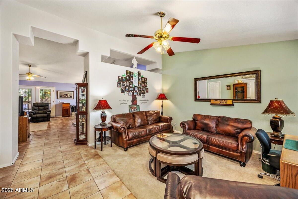 49 West Ivanhoe Street Gilbert, AZ 85233 - Photo 10 of 54 a living room with furniture a rug and white walls
