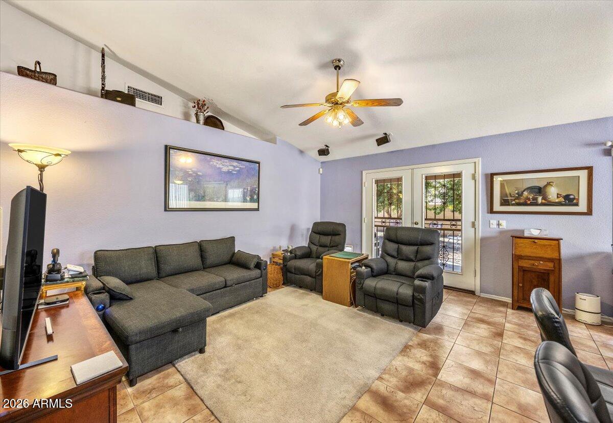 49 West Ivanhoe Street Gilbert, AZ 85233 - Photo 16 of 54 a living room with furniture and a flat screen tv