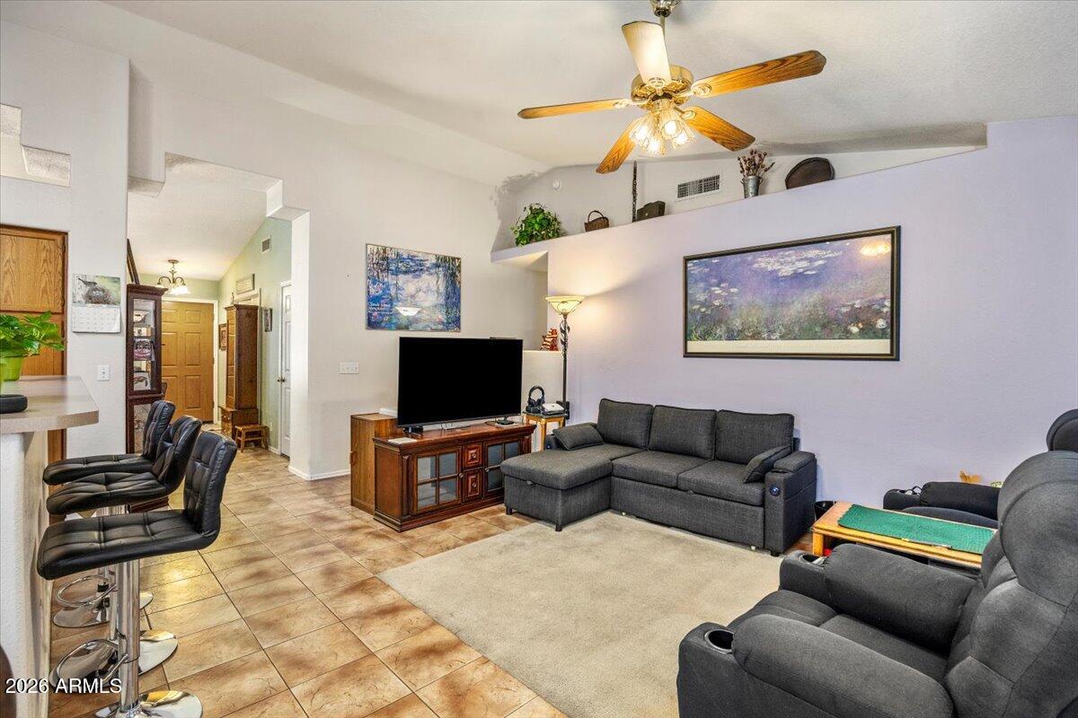 49 West Ivanhoe Street Gilbert, AZ 85233 - Photo 17 of 54 a living room with furniture and a flat screen tv
