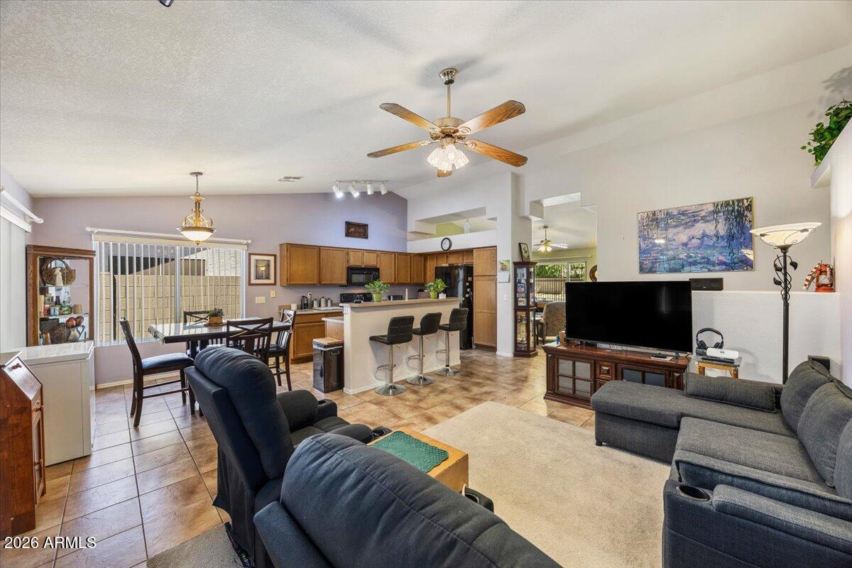 49 West Ivanhoe Street Gilbert, AZ 85233 - Photo 19 of 54 a living room with furniture and a flat screen tv
