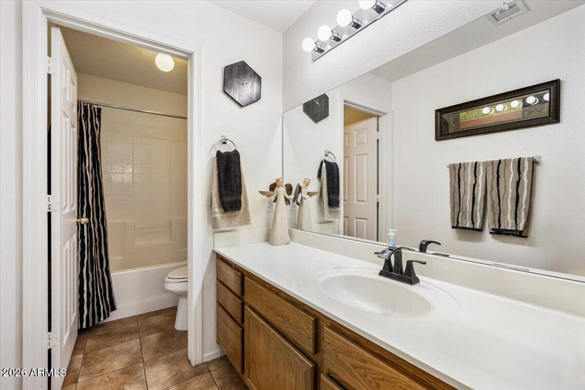 49 West Ivanhoe Street Gilbert, AZ 85233 - Photo 26 of 54 a bathroom with a double vanity sink and a mirror