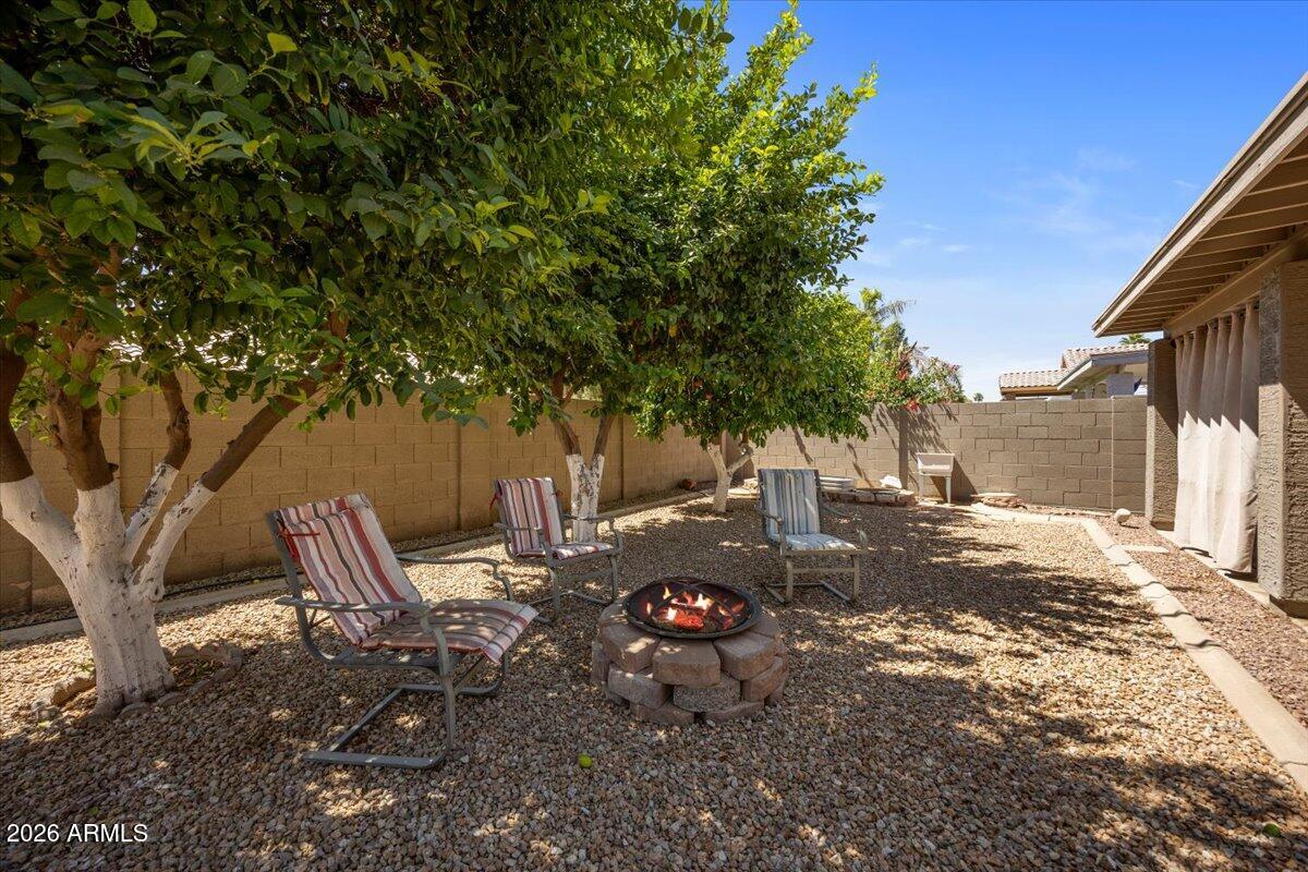 49 West Ivanhoe Street Gilbert, AZ 85233 - Photo 30 of 54 a backyard of a house with table and chairs