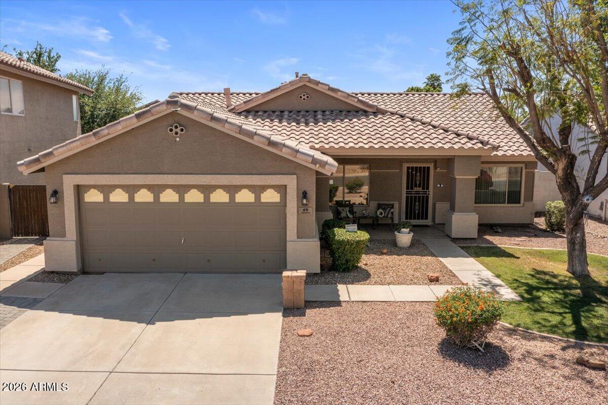 49 West Ivanhoe Street Gilbert, AZ 85233 - Photo 34 of 54 a front view of a house with a yard