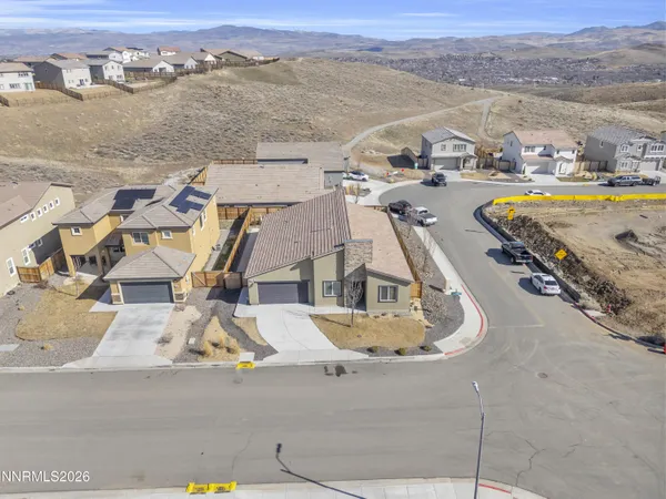 an aerial view of a residential houses with outdoor space