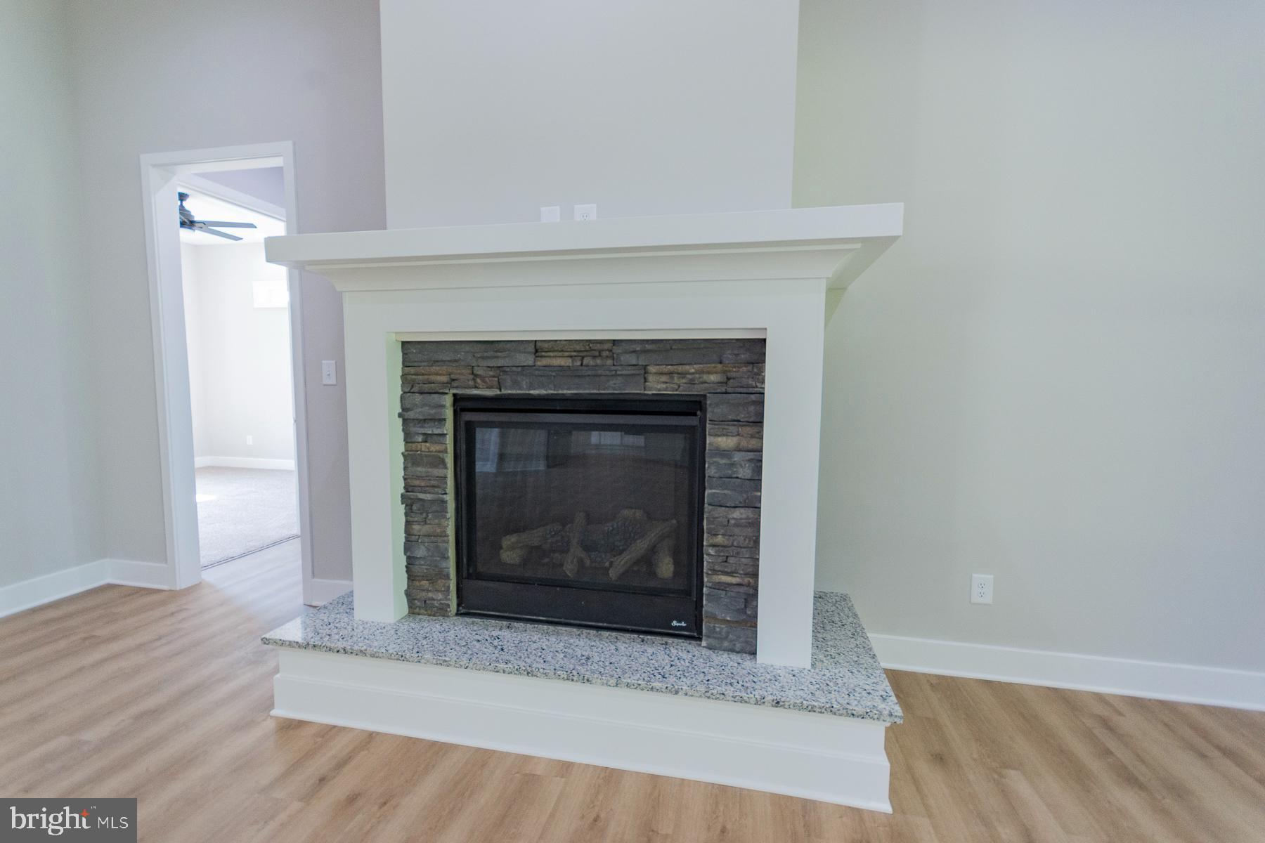 85 Glenaire Road Bunker Hill, WV 25413 - Photo 28 of 68 a living room with a fireplace