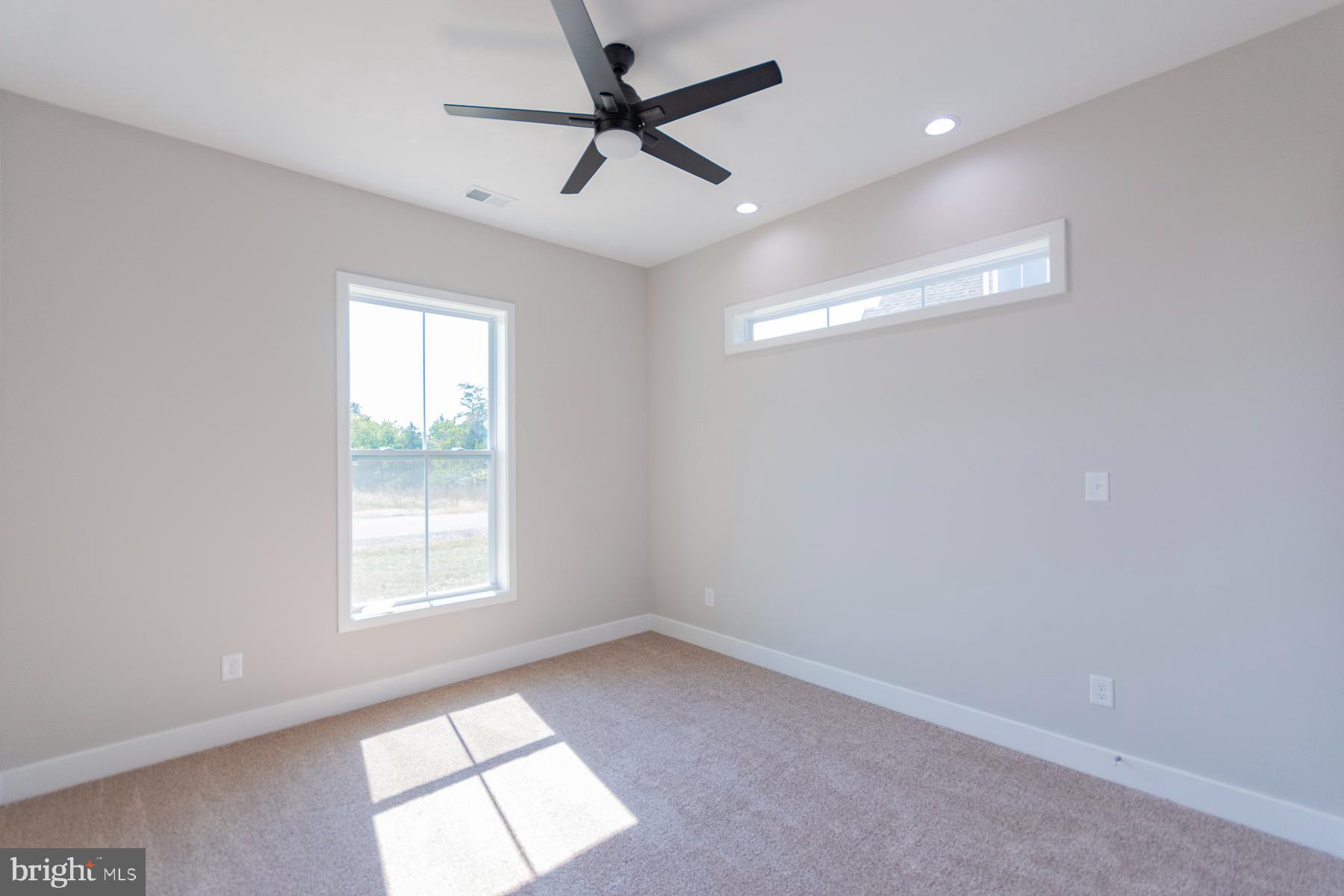 85 Glenaire Road Bunker Hill, WV 25413 - Photo 43 of 68 an empty room with windows and fan