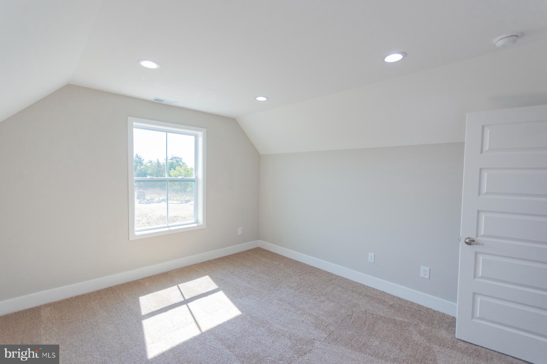 85 Glenaire Road Bunker Hill, WV 25413 - Photo 49 of 68 an empty room with windows