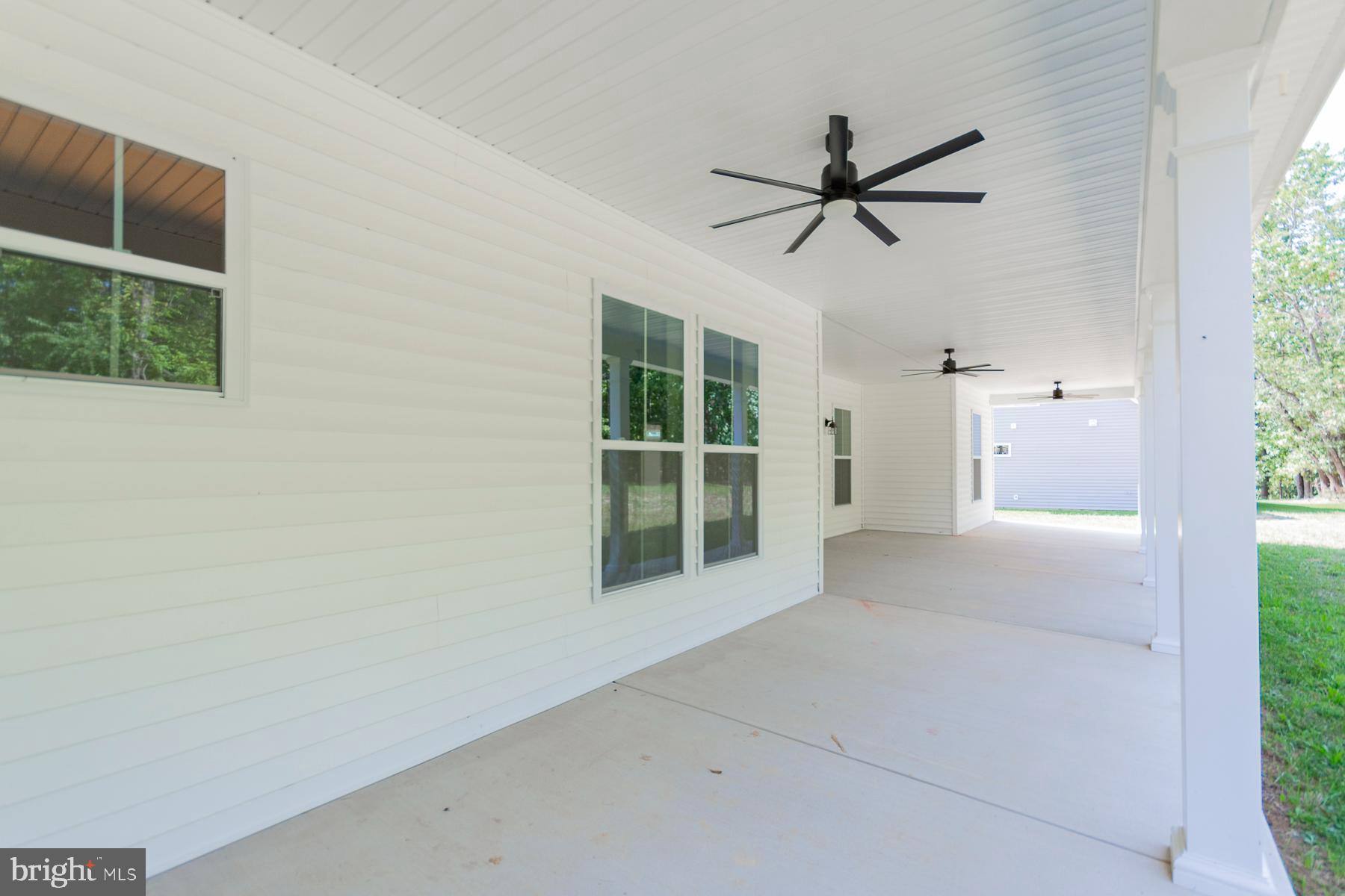 85 Glenaire Road Bunker Hill, WV 25413 - Photo 52 of 68 a view of a livingroom with a ceiling fan and window