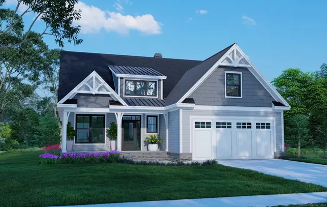 a front view of a house with a yard and potted plants