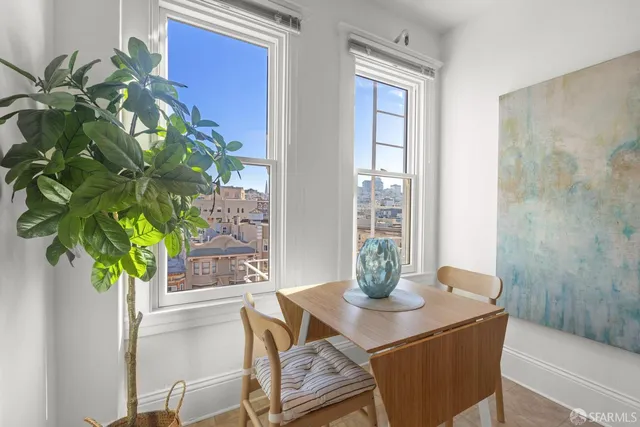 a view of a dining room with furniture window and wooden floor