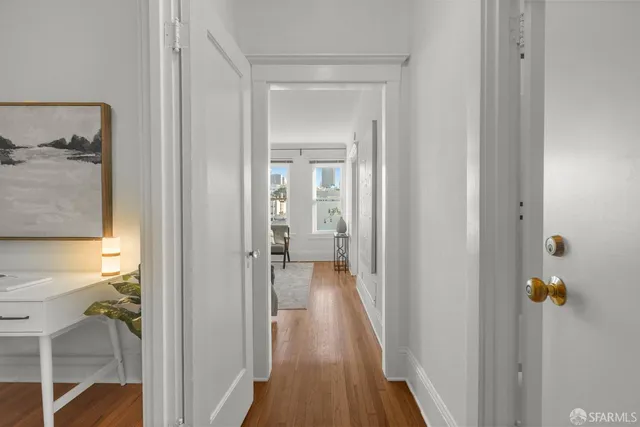 a view of a bathroom from a hallway
