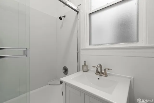 a bathroom with a sink and mirror