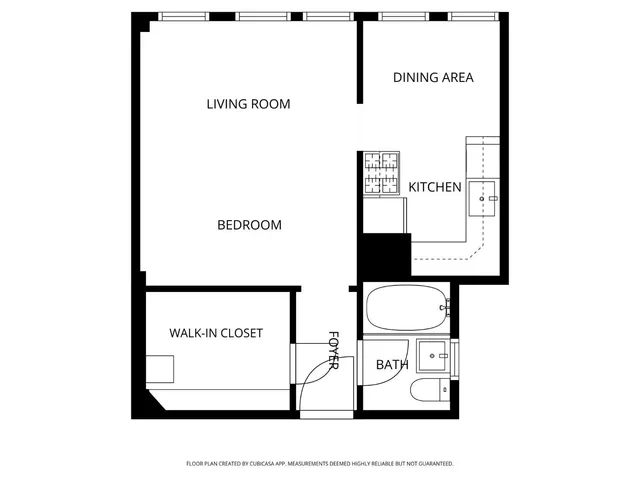 a picture of a bench in front of a wall