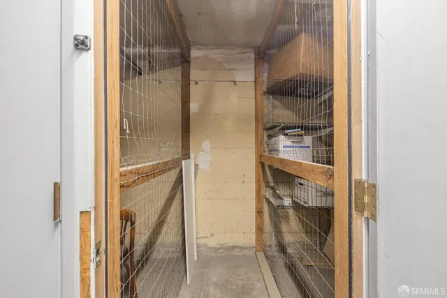 a bathroom with a glass shower door and a sink