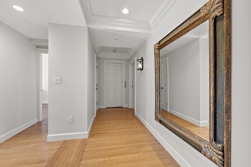 412 Beacon Street, Unit 6 Boston, MA 02115 - Photo 15 of 16 a view of a hallway with wooden floor