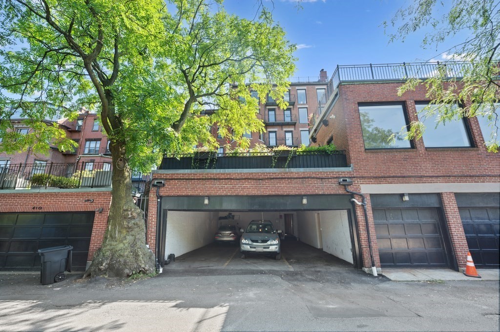 412 Beacon Street, Unit 6 Boston, MA 02115 - Photo 16 of 16 a house with trees in front of it