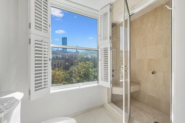 a bathroom with a bathtub and a shower