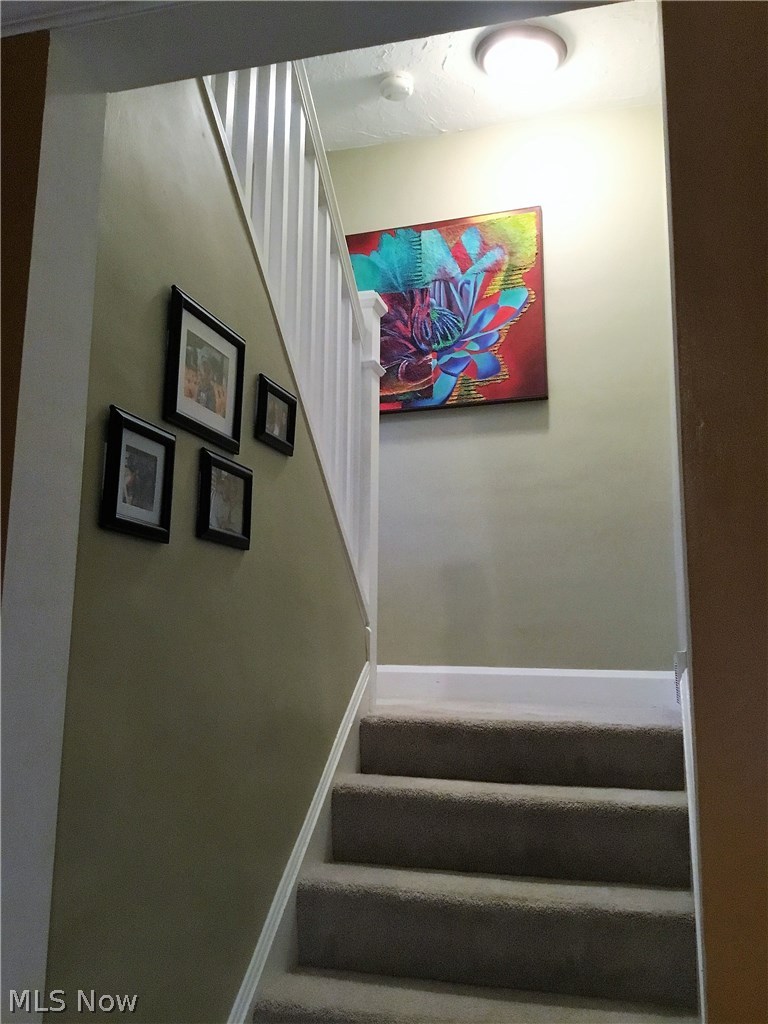 1359 Irene Road Lyndhurst, OH 44124 - Photo 16 of 32 Even the staircase is something special to look at. Hand rail is removable for moving in large pieces.