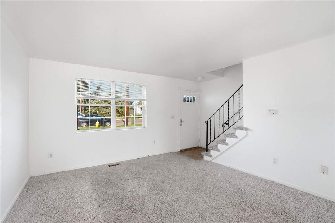 5414 Lamme Road Dayton, OH 45439 - Photo 5 of 32 This bright living space offers a seamless transition to the upper level with a modern staircase.