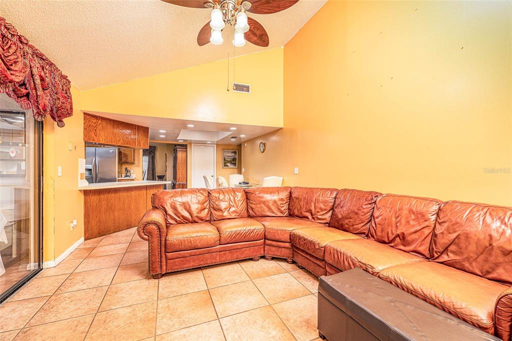 2903 Silver Ridge Drive Orlando, FL 32818 - Photo 18 of 27 a view of a terrace with furniture and a ceiling fan